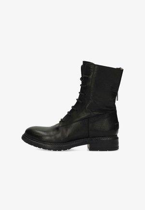 Zwarte leren veterschoenen tot de enkel met een ronde neus, een zijrits en een gestructureerd oppervlak. Voorzien van een lage blokhak en stiksels.