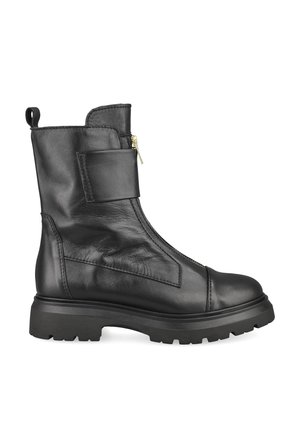 Black leather ankle boot with chunky sole, side zipper, and wide strap across front, shown from the inner side on white background.