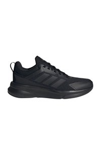 Basket noir avec une tige en mesh texturé, un système de laçage et une semelle rembourrée. Présente trois rayures en relief sur le côté.