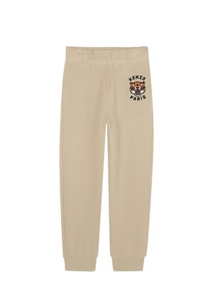 Beige Sweatpants mit einem elastischen Bund und Bündchen sowie einem Tiger-Logo mit dem schwarzen Text "KENZO PARIS" am linken Oberschenkel.