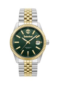 Orologio con quadrante verde e dettagli in tono oro, cinturino in acciaio inossidabile argento e oro, display della data e resistenza all'acqua fino a 50 metri.