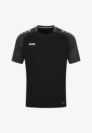 T-shirt de sport noir à manches courtes, avec un motif texturé sur les épaules, et un logo blanc "JAKO" sur le devant.