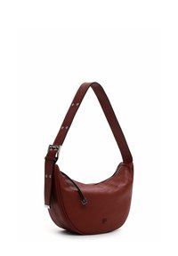 Red leather shoulder bag with a curved shape, adjustable strap featuring silver hardware, and a zipper accent on one side.