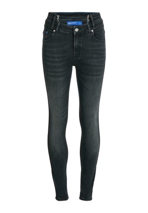 Mustad kitsad teksad eesnupu ja tõmblukuga, viie taskuga stiilis ning sääreosadel õrnalt tuhmuvad, etiketiga "Karl Lagerfeld Jeans."
