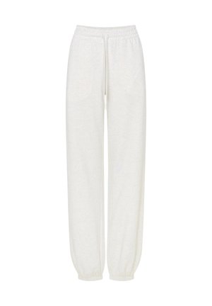 Białe bawełniane spodnie dresowe z elastycznym paskiem, sznurkiem do wiązania i elastycznymi mankietami, przedstawione na białym tle.