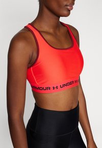 Under Armour CROSSBACK MID  - Medium support sports bra - racer red/cardinal/black
