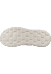 Suela de zapato con una superficie de goma blanca texturizada que presenta un patrón de rectángulos redondeados y círculos para tracción.