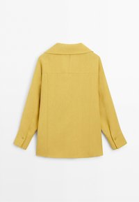 Long-sleeve yellow jacket with buttoned cuffs, a collar, and simple back seam details, shown from the back on a white background.