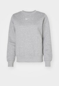 Grå sweatshirt i bomullsblandning, med rund halsringning, långa ärmar, ribbade ärmslut och en liten vit Nike-logga på bröstet.