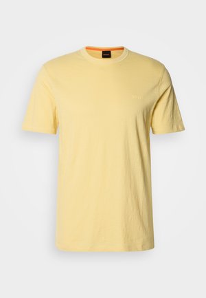 Yellow crew neck t-shirt made of soft fabric, featuring short sleeves. Subtle "BOSS" logo embroidered in matching color on the chest.