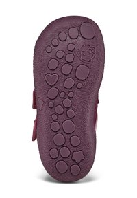 Sole di scarpa in gomma viola con una serie di battistrada rotondi e ovali, caratterizzati da motivi che includono un cuore, una stella e dettagli con il volto di una scimmia.