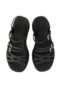 Sandali neri con più cinghie testurizzate e chiusure regolabili. Le cinghie presentano un sottile motivo di glitter; le suole hanno una superficie scanalata.