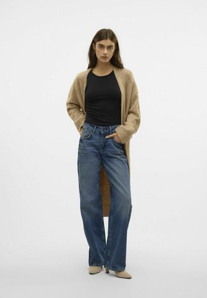 Beige cardigan with open front, black top, and blue wide-leg jeans. Smooth fabric, relaxed fit, subtle texture, and neutral tones.