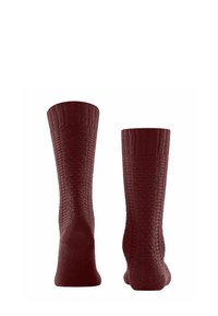 Calze al ginocchio bordeaux con un design a coste testurizzato. Presentano un ampio polsino e una costruzione senza cuciture alla punta per un comfort maggiore.