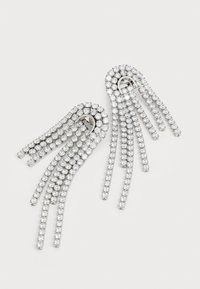 Rhinestone earrings with silver-tone metal. Features a curved, layered design with multiple dangling chains of crystals.