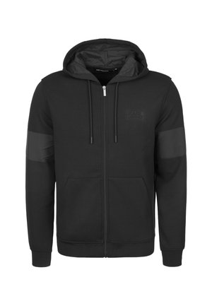 Černá mikina na zip vyrobená z měkké látky, s podšívkou na kapuci, předními kapsami a texturovanými akcenty na rukávech. Diskrétní logo na hrudi.