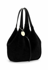 Black plush handbag with sleek black leather handles. Features a metal charm and a soft, rounded design with a texture resembling fur.