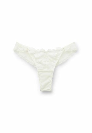 Witte kanten string met bloempatronen, golvende randen en een soepele tailleband met decoratieve hardwareaccenten.