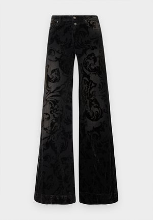 Calças pretas de perna larga em veludo estampado, com um desenho de redemoinho texturizado, dois botões frontais e um estilo clássico de ganga.