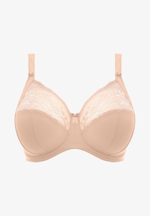 Beige bh met opmerkelijke kantafwerking aan de bovenkant, beugelondersteuning en verstelbare banden. Heeft een gladde textuur met bloemige kantdetails.