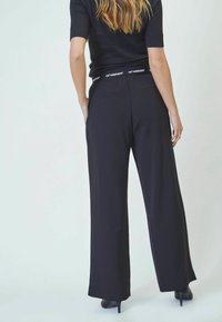 Co'couture AMINACC LOGO PANT - Trousers - black