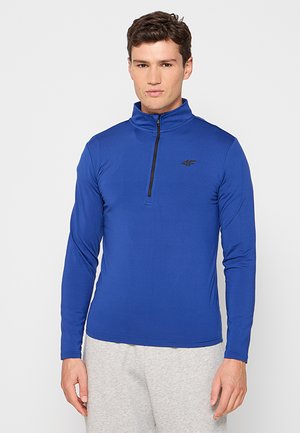 Niebieski długi rękaw pulower z lekkiego materiału, z ćwierć zamkiem błyskawicznym i małym czarnym logo na piersi.