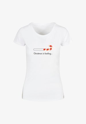 White cotton T-shirt featuring a playful "Christmas is loading..." text and a graphic of a red and white candy cane. Short sleeves, rounded neckline.