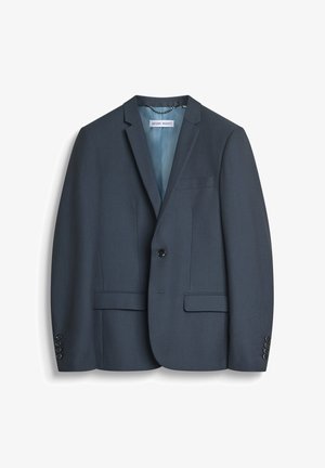 Blazer azul oscuro de tela texturizada, con un solo botón, solapas con muesca y un bolsillo en el pecho. Detalle de puños con cuatro botones.