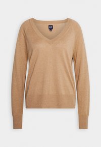 Pull beige à manches longues avec col en V et poignets ainsi qu'ourlet côtelés, présenté sur un fond blanc.