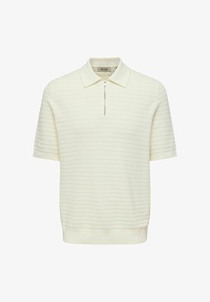 Lühikeste varrukatega polo-särk struktureeritud kreemjas kangas, millel on tõmblukuga krae ja soonikkoes mansetid. Sile viimistlus peente horisontaalsete mustritega.