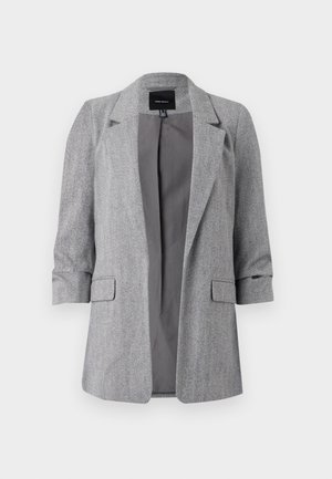 Blazer grigio a spina di pesce con reversal, maniche arrotolate e due tasche frontali. Interno non foderato, forma moderna e tailored.