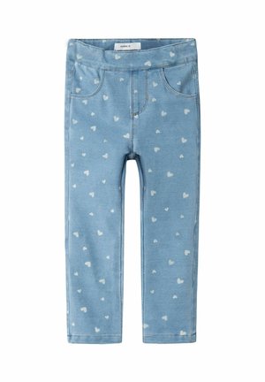 Leggings bleus pour enfants avec motifs de cœurs blancs et taille élastique, poches à l'avant et détails de coutures surpiquées.
