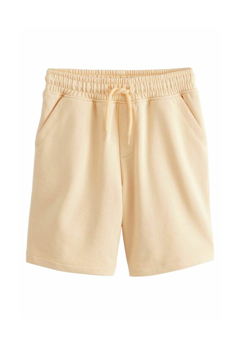 Shorts en coton couleur pêche avec une taille élastique, un cordon de serrage ajustable et deux poches latérales. Texture lisse et design décontracté.