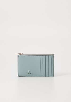 Light blue leather wallet with multiple card slots and a zippered compartment. Features a subtle logo embossed on the front.