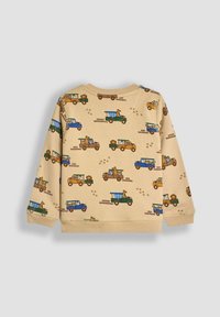 Maglione in cotone beige chiaro con un motivo giocoso di camion colorati e animali, maniche lunghe e scollo rotondo.