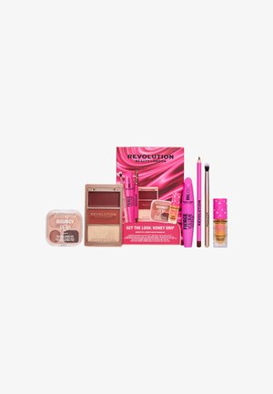 Set de maquillage comprenant des palettes de fards à paupières, du mascara, du gloss, un crayon eye-liner, un pinceau et un baume à lèvres avec un emballage rose et neutre.