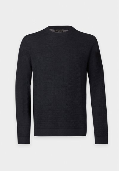 Pull noir à manches longues avec col rond, motif texturé subtil, poignets et ourlet côtelés, présenté sur un fond uni gris clair.