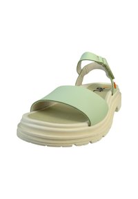 Grøn sandal med en bred rem og justerbar ankelrem, der har en tyk hvid sål og en struktureret indersål for komfort.