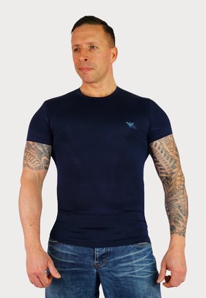 Kurzärmeliges navyblaues T-Shirt aus elastischem Stoff, mit einem runden Ausschnitt und einem kleinen Logodetail auf der Brust.