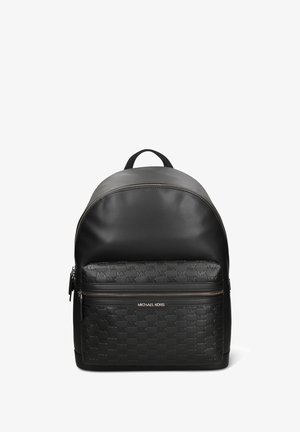 Black leather backpack featuring a rounded top, front zip pocket with embossed logo pattern, and silver-tone zipper hardware.