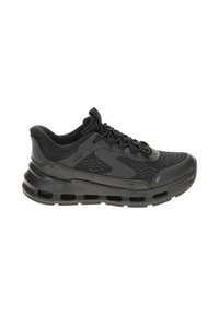 Scarpa atletica nera Skechers slip-on con suola ammortizzata e dettagli in mesh, mostrata in profilo laterale su sfondo bianco.