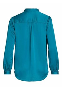 Blouse bleu sarcelle à manches longues avec poignets boutonnés, légères fronces sous le yoke et ourlet droit au dos.