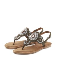 Beaded sandals with a green leather strap, tan suede footbed, and decorative circular embellishments in silver and brown tones.
