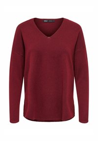 Maglietta bordeaux a maniche lunghe con scollo a V, texture morbida, vestibilità rilassata e orlo leggermente arrotondato. Etichetta visibile all'collo.