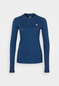 Long-sleeve top in dark blue fabric, crew neckline, fitted design, featuring a small, contrasting logo on the left chest. Smooth texture.