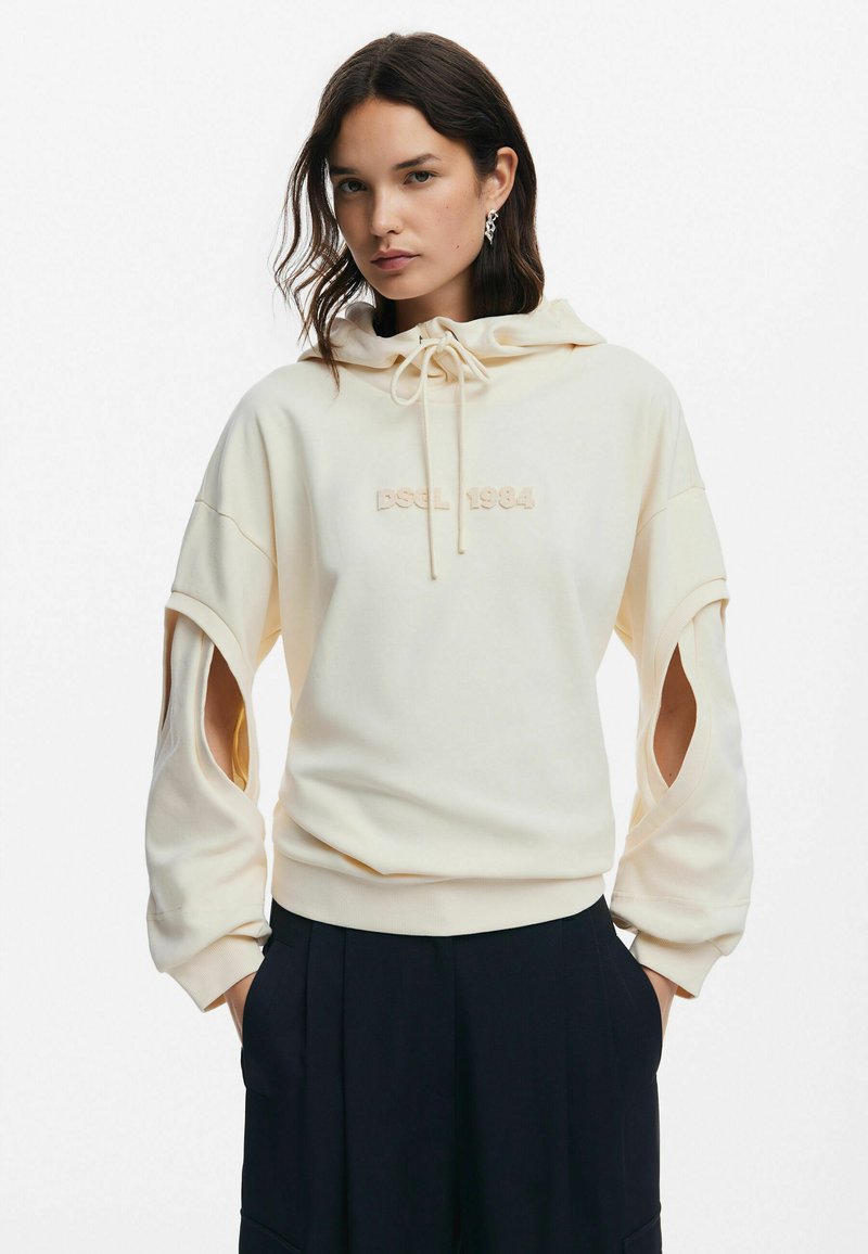 Cream hooded sweatshirt with cut-out sleeves, embellished with "DSL 1984" in matching embroidery. Soft texture, relaxed fit, and drawstring detail.