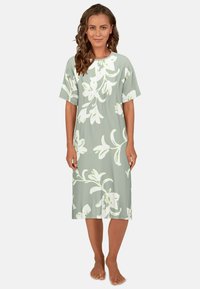 Vestito floreale a maniche corte, verde chiaro con motivi bianchi a fiori, vestibilità morbida, lunghezza al ginocchio, realizzato in tessuto morbido, scollatura rotonda.