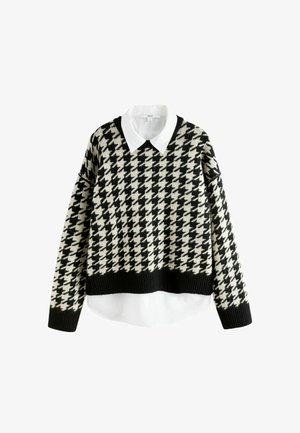 Sort-hvid houndstooth-mønstret sweater med cropped design, der har en hvid krave-inddæmning ved halsen. Strikket stof.