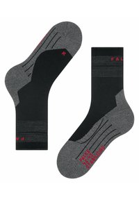 Calzini neri e grigi con punta e tallone rinforzati, con accenti e motivi rossi. Il testo dice "Fila" e "Stabilizzante."