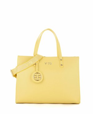 Borsa a tracolla gialla in pelle con due manici superiori, tracolla rimovibile, accentuazione del logo circolare e nome del brand impresso. Texture liscia.